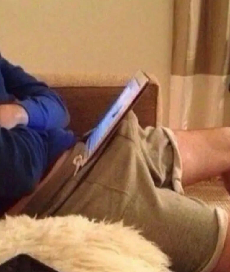 Guy Holding his iPad up